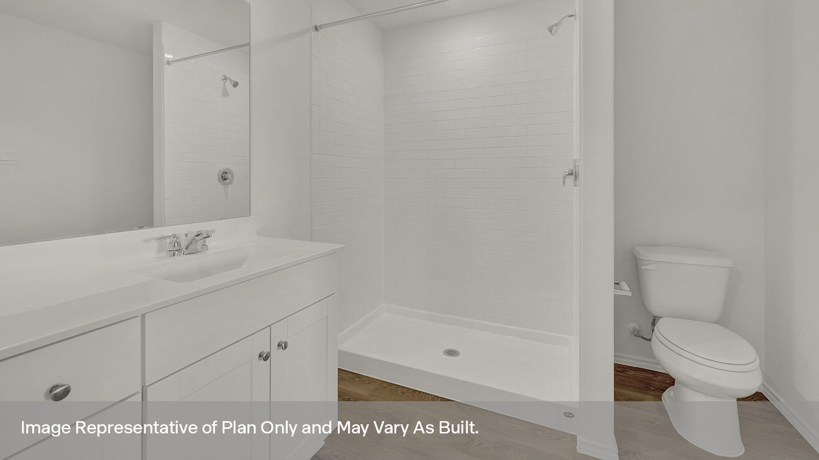 Primay bath with an extended vanity, toilet and walk in tile surround shower