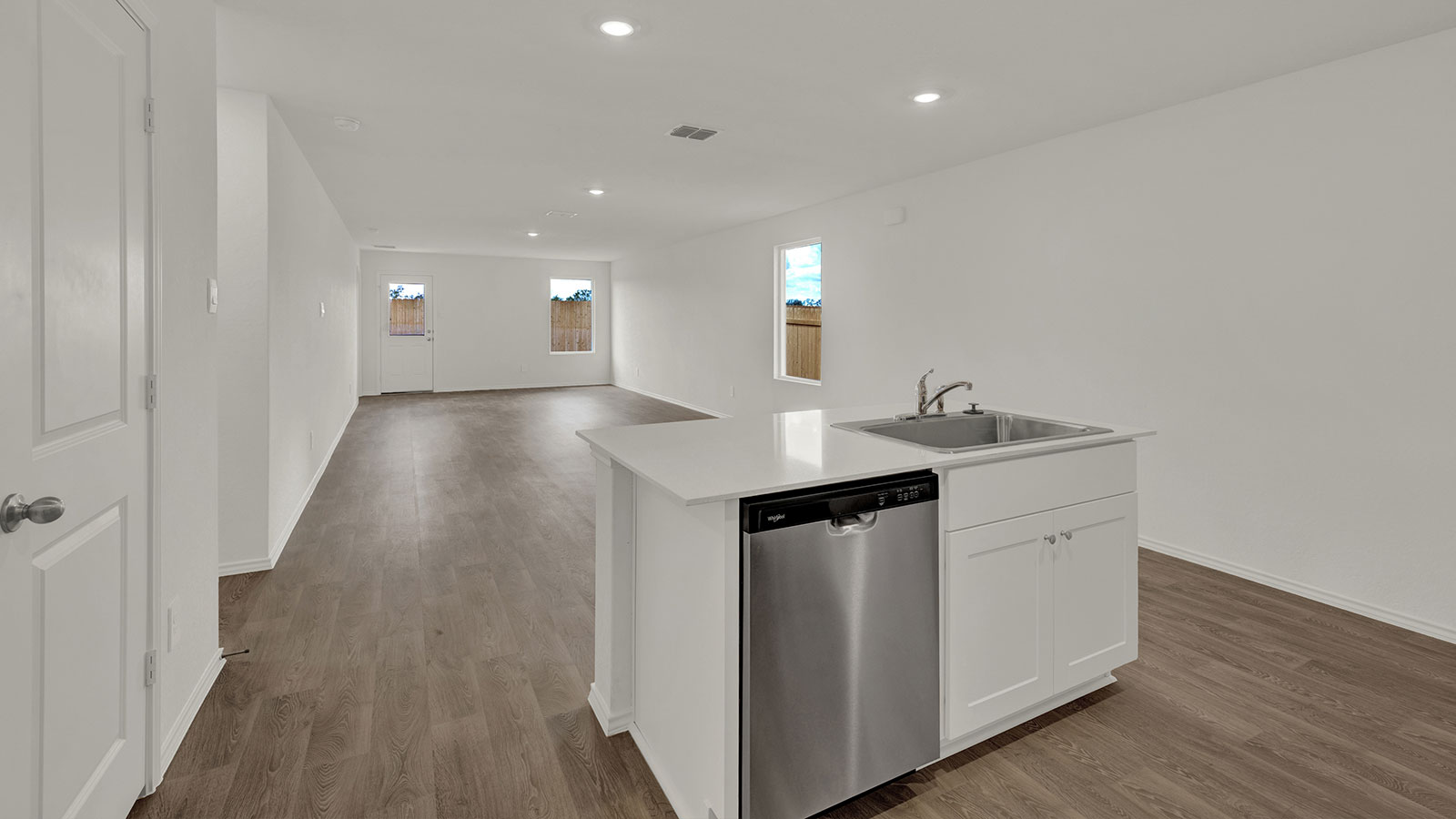 Kitchen with quartz countertops and stainless-steel appliances.