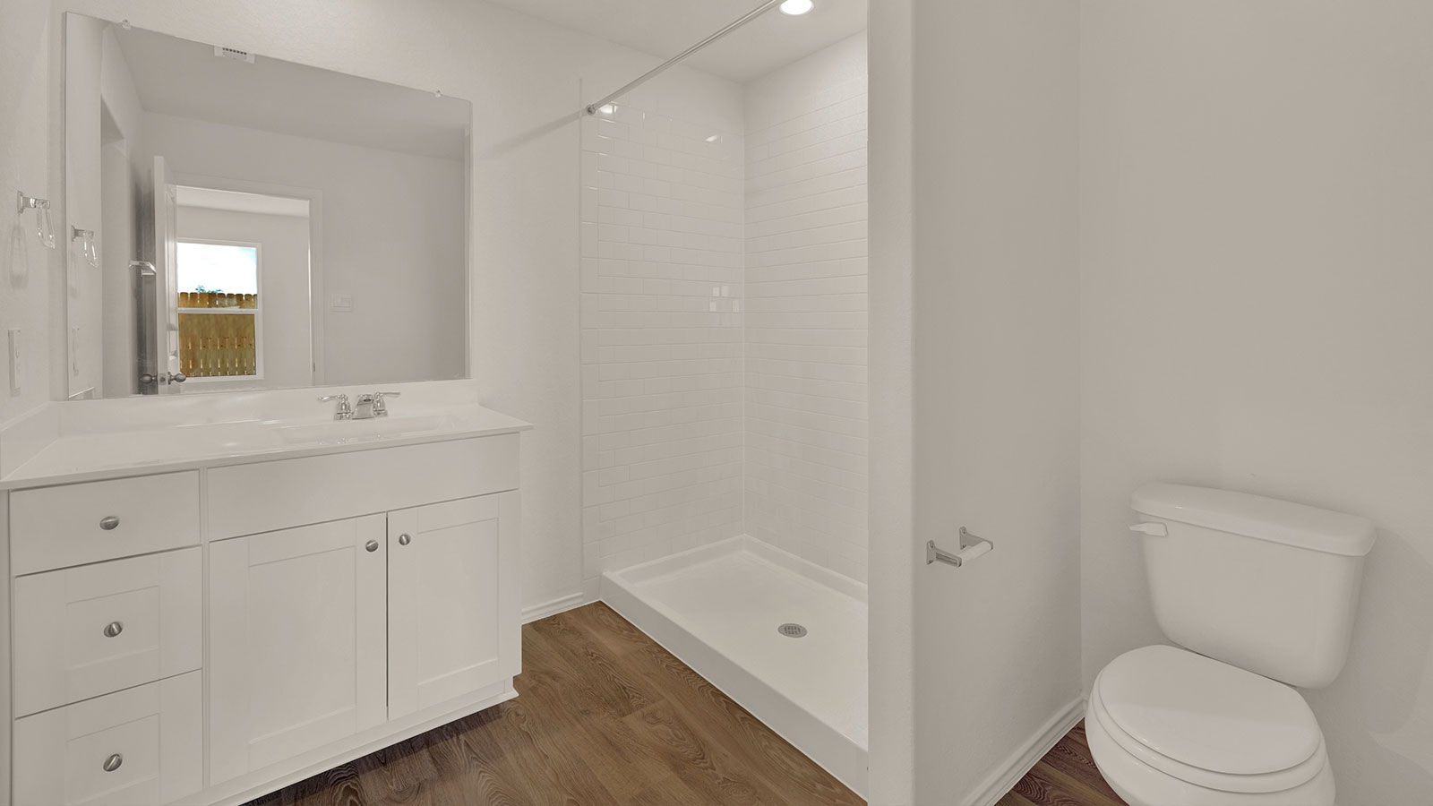 Main bathroom with shower, toilet, and sink.