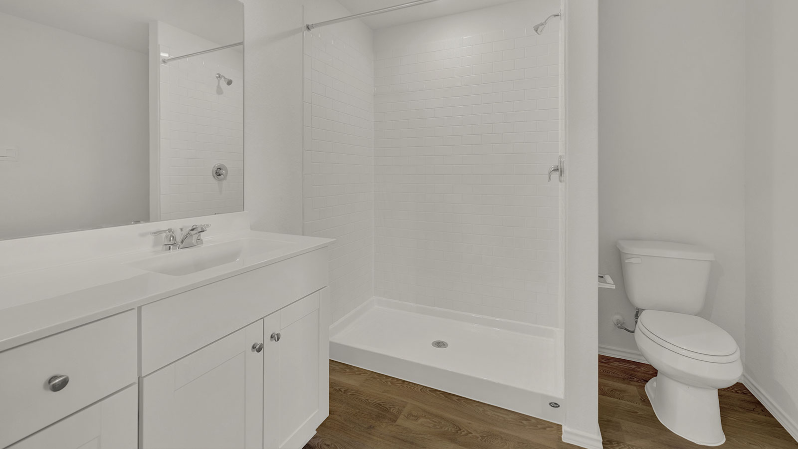 Main bathroom with shower, toilet, and sink.