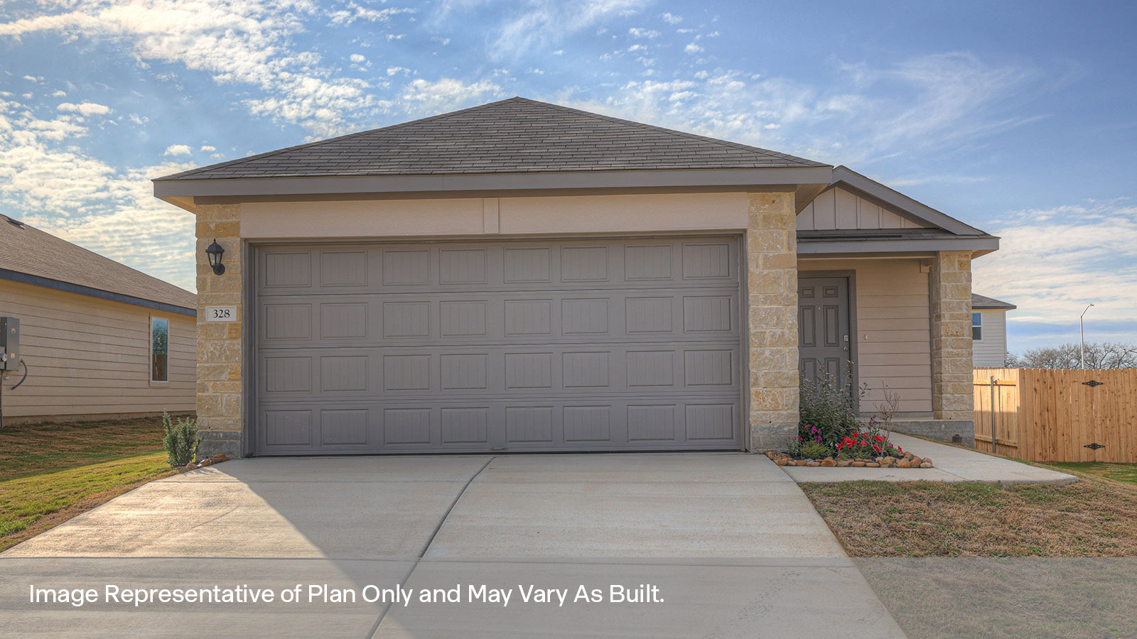 two car garage, siding and a wrap around sidewalk to the front entry