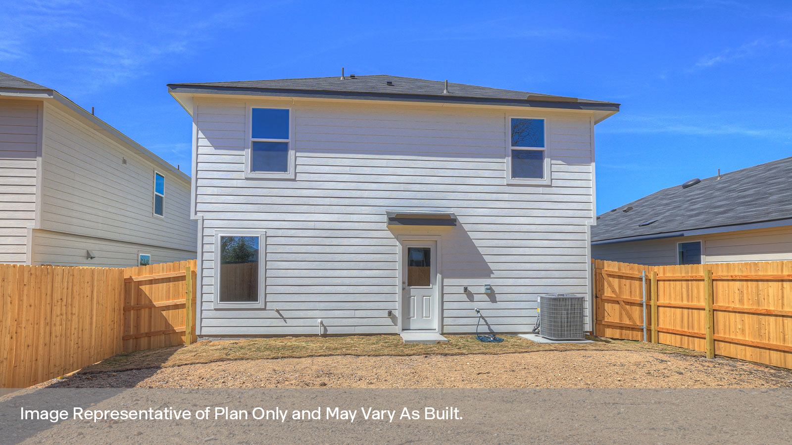 Rear exterior featuring 3 windows and the back door