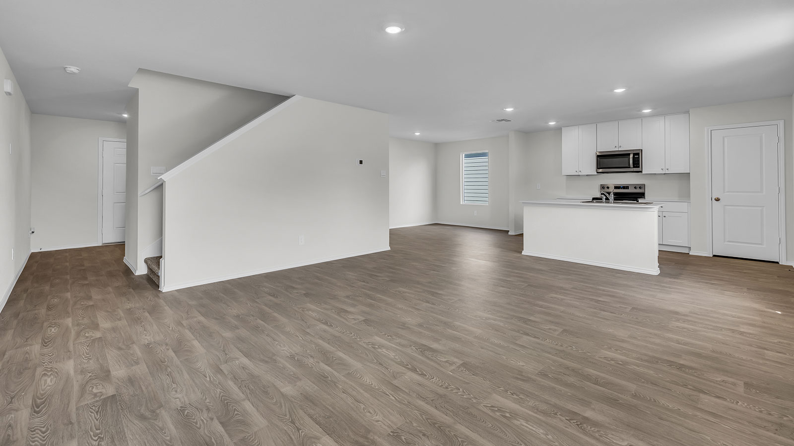 Entry hallway showing staircase and entering the living room.