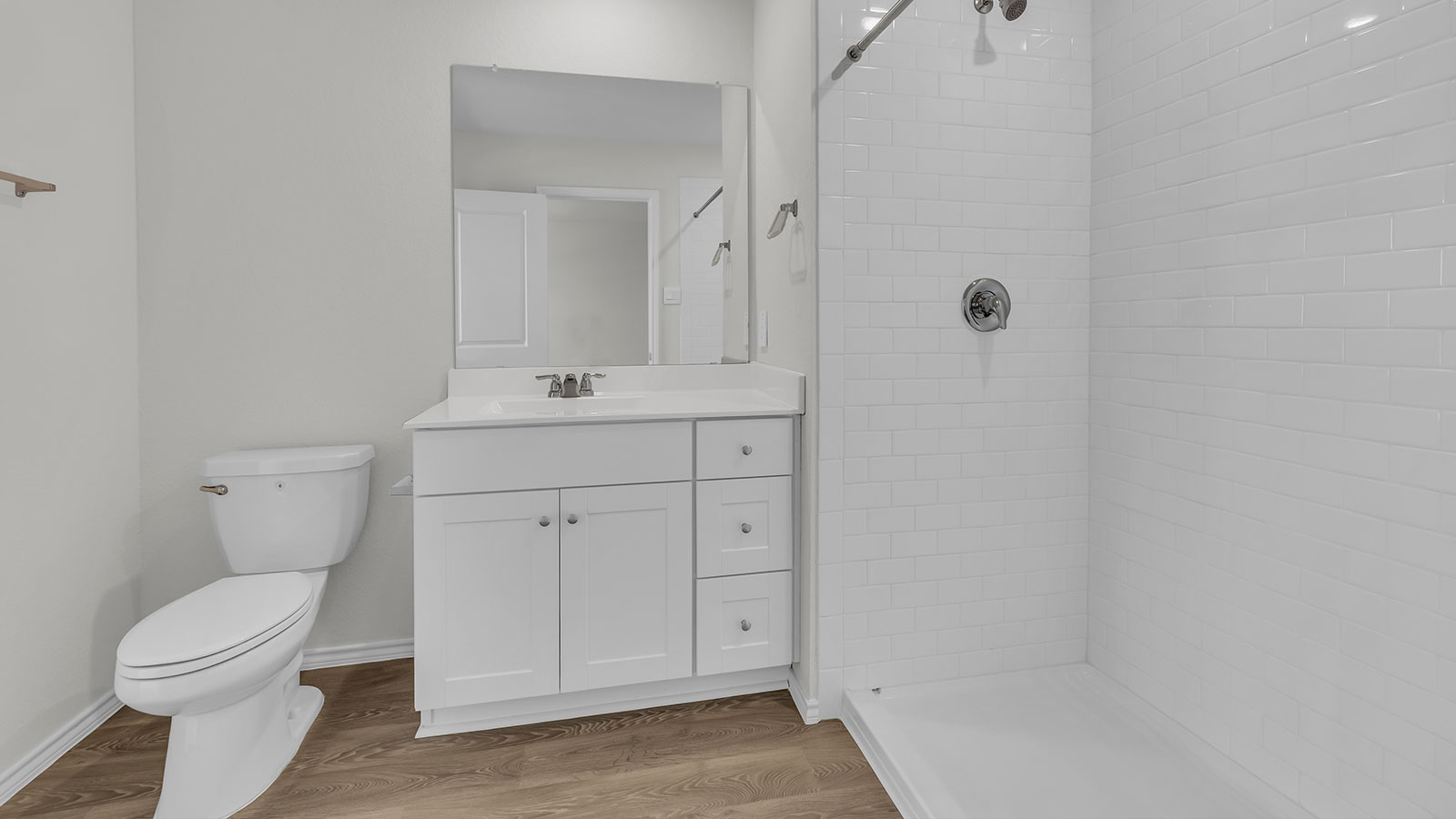Main bathroom with sink and closet entry.