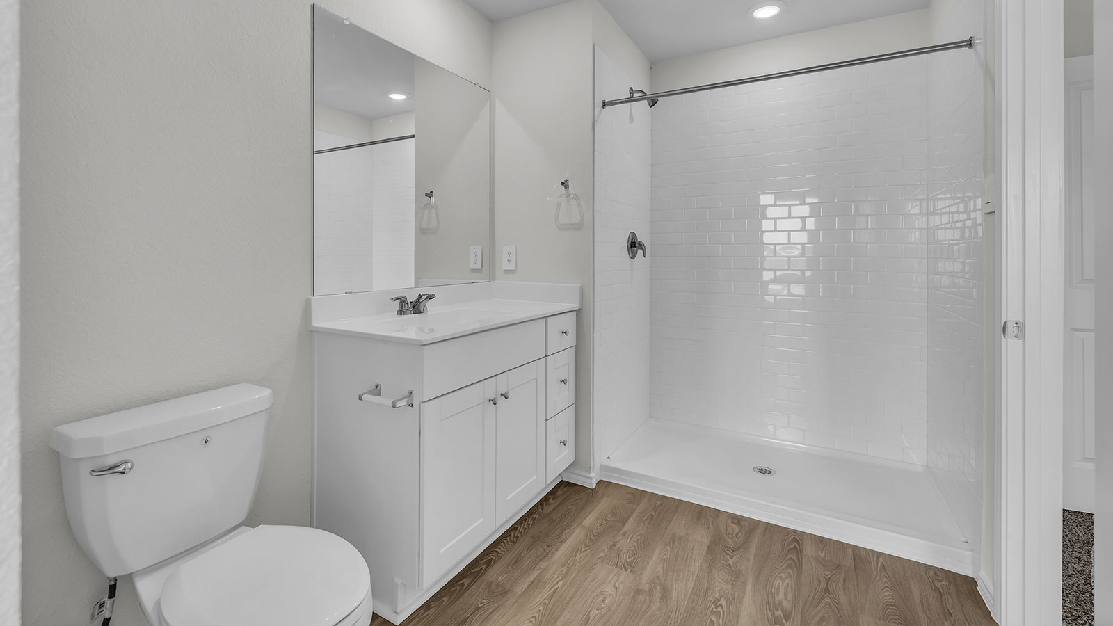 Main bathroom with sink, toilet, and shower.