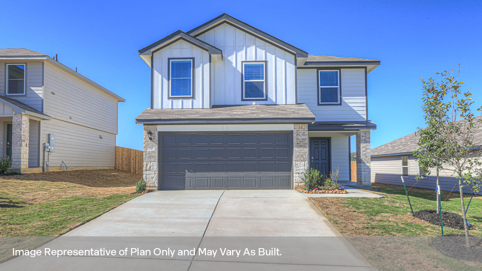2-story home with a two car garage and siding exterior