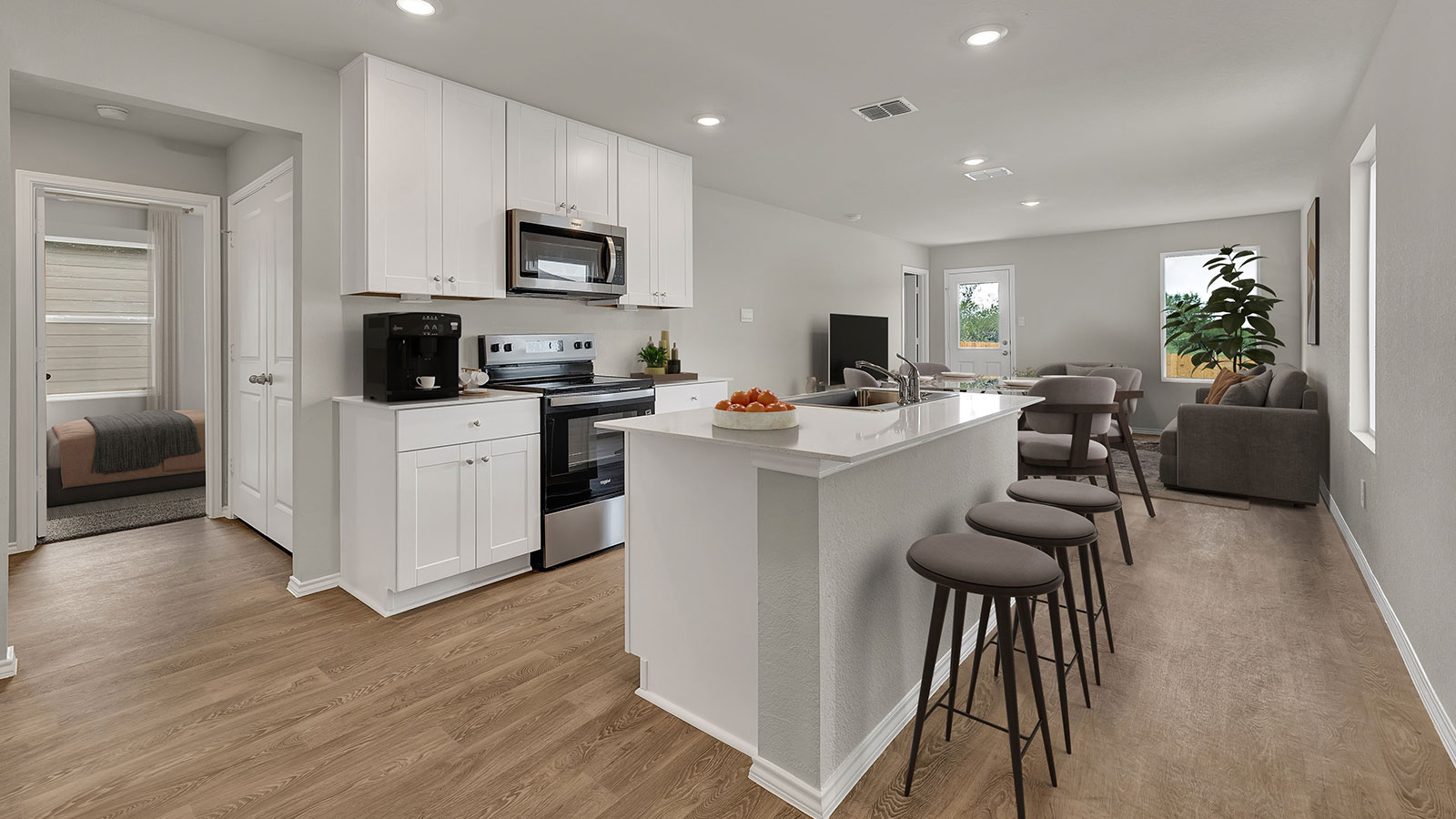 Virtually staged kitchen with kitchen island high stools.