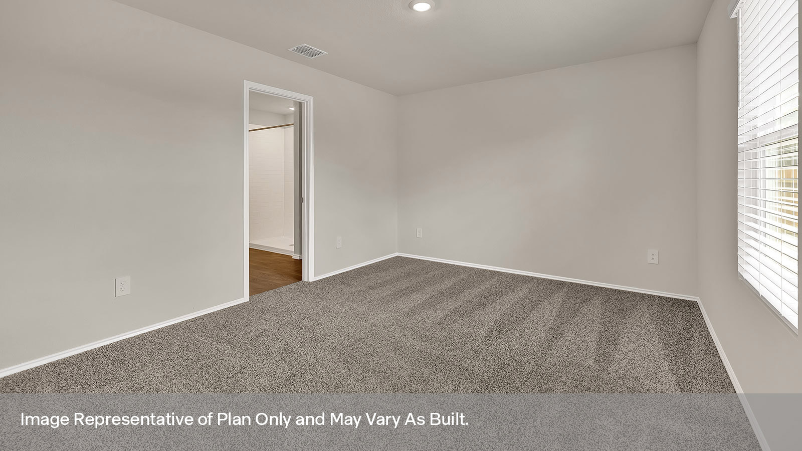 Main bedroom with carpeting and one window.