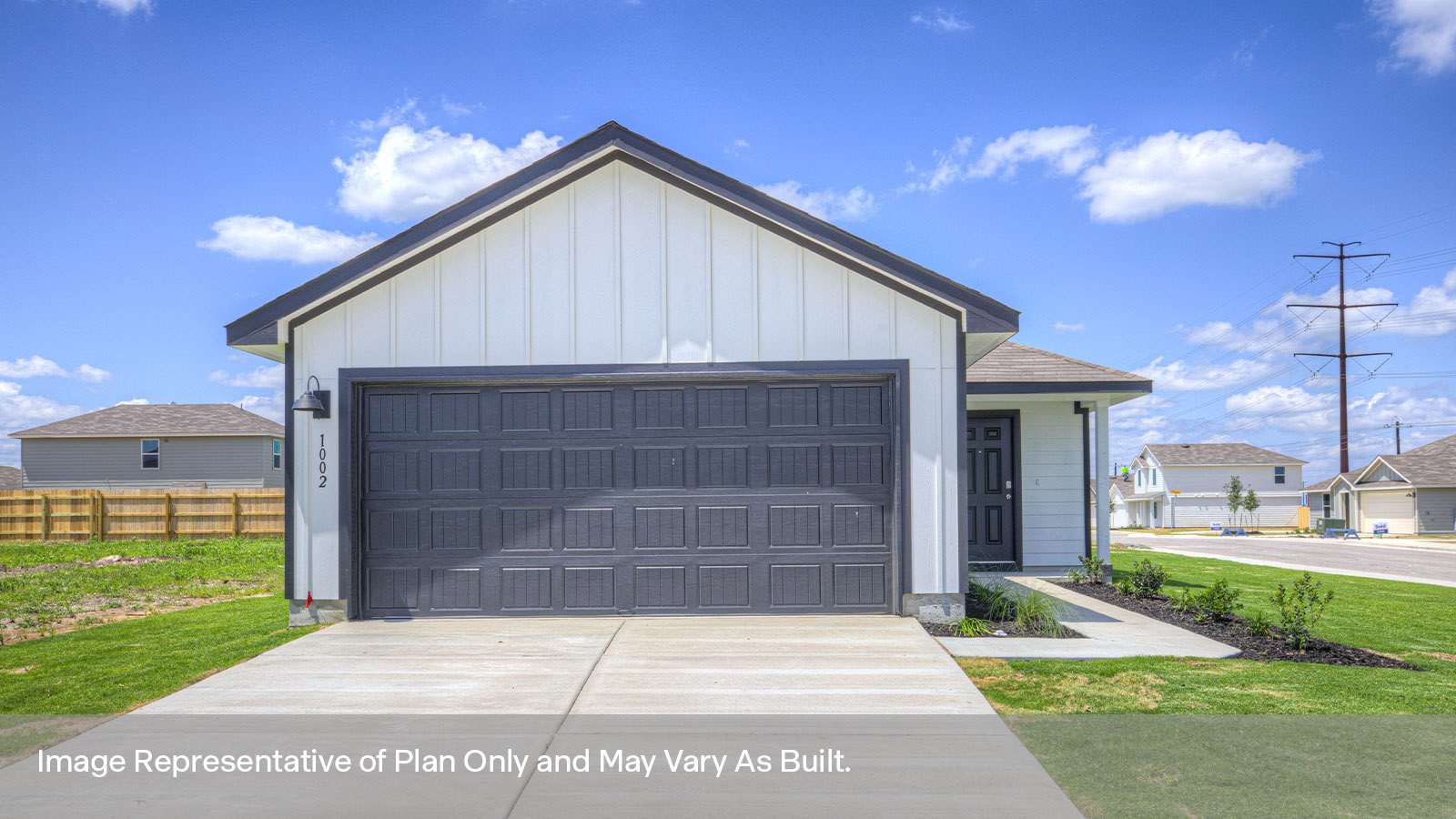 Single-story farmhouse with 2 car garage.