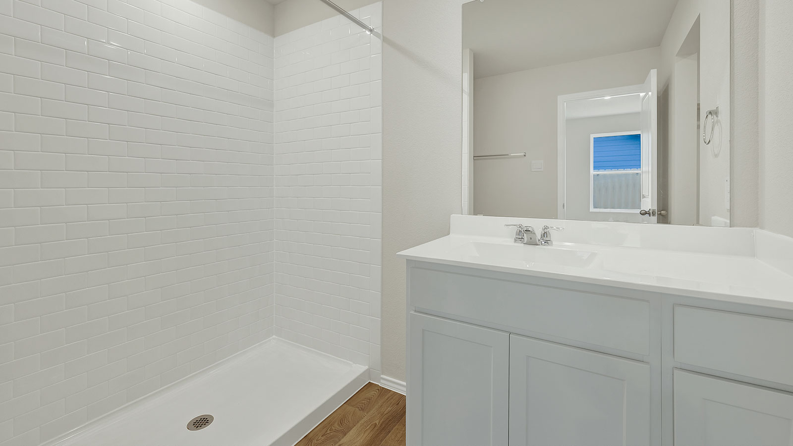 Main bathroom with shower, toilet, and sink.
