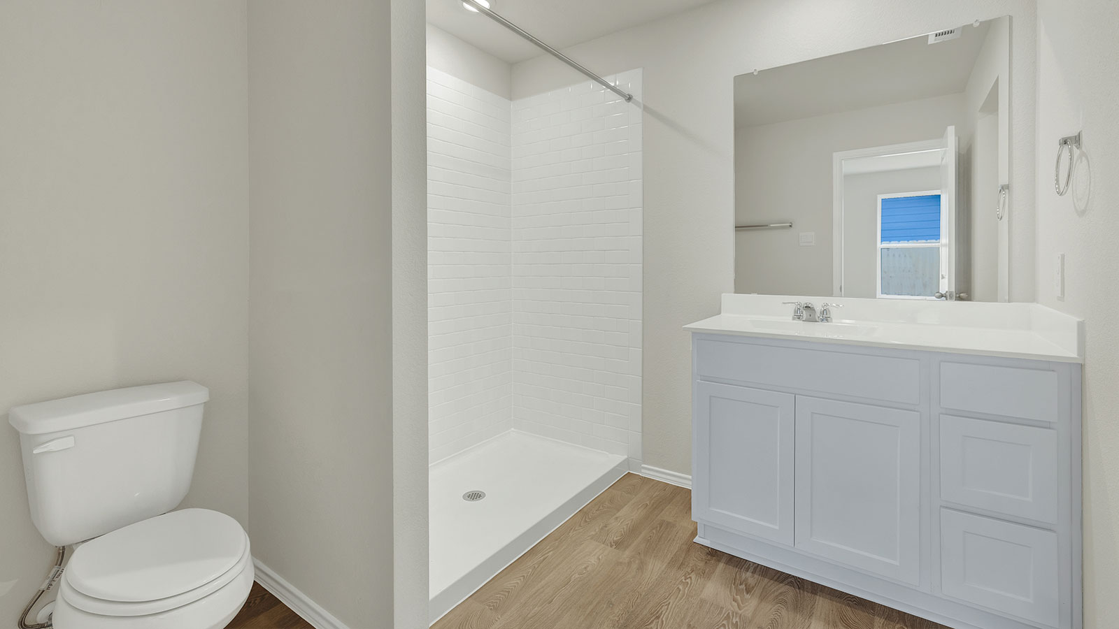 Main bathroom with shower, toilet, and sink.