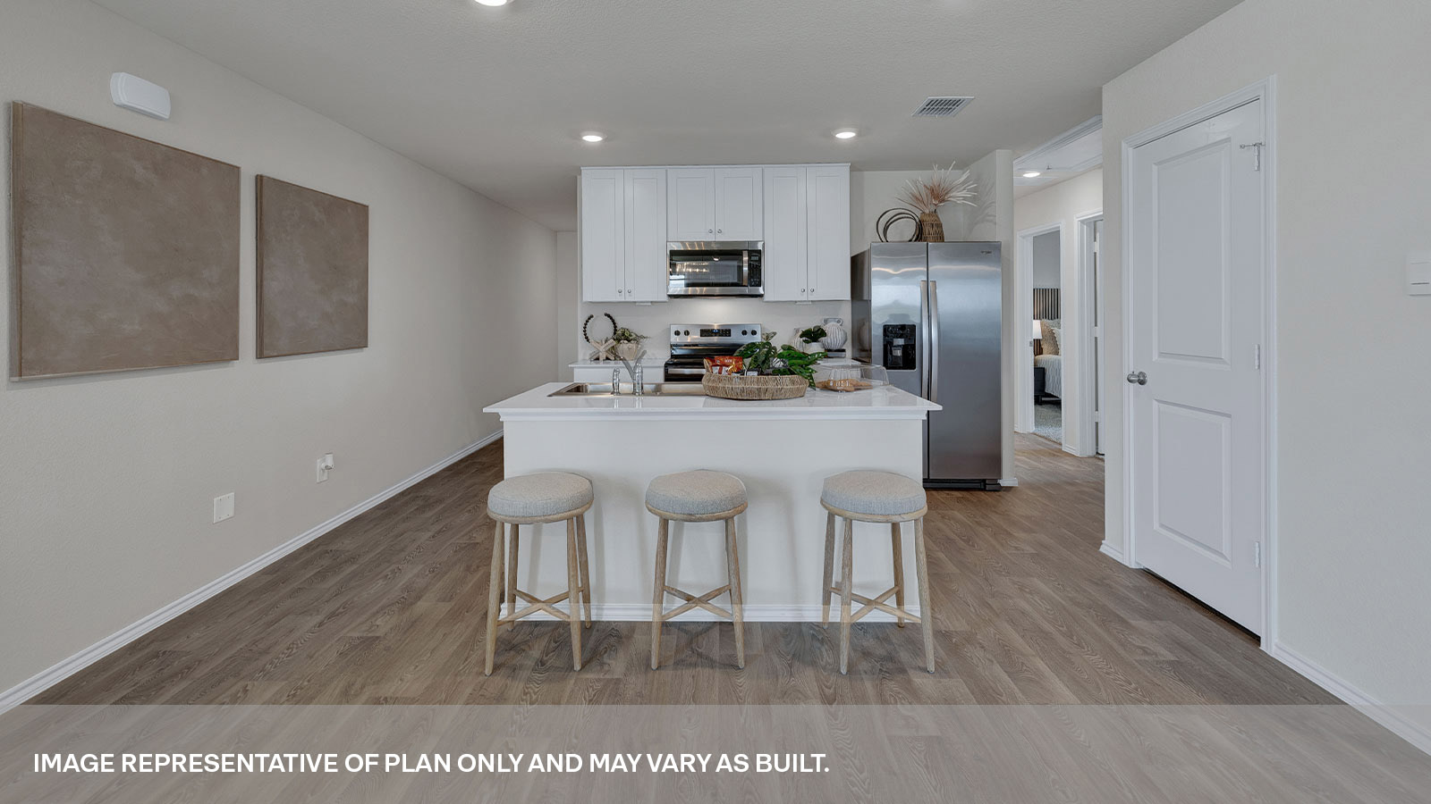 Kitchen with kitchen island and white cabinets.