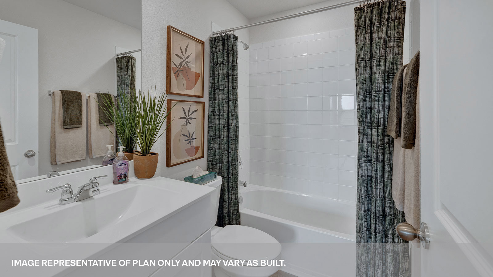 Hall bathroom with single-sink vanity, toilet, and tub.
