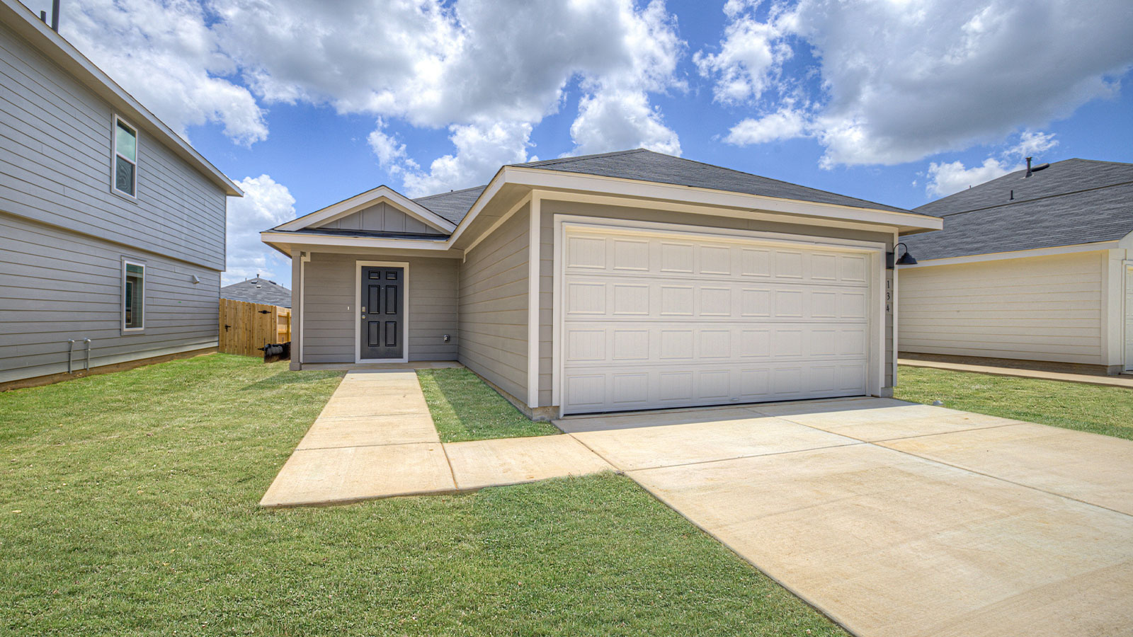 Single-story with farmhouse exteriors.