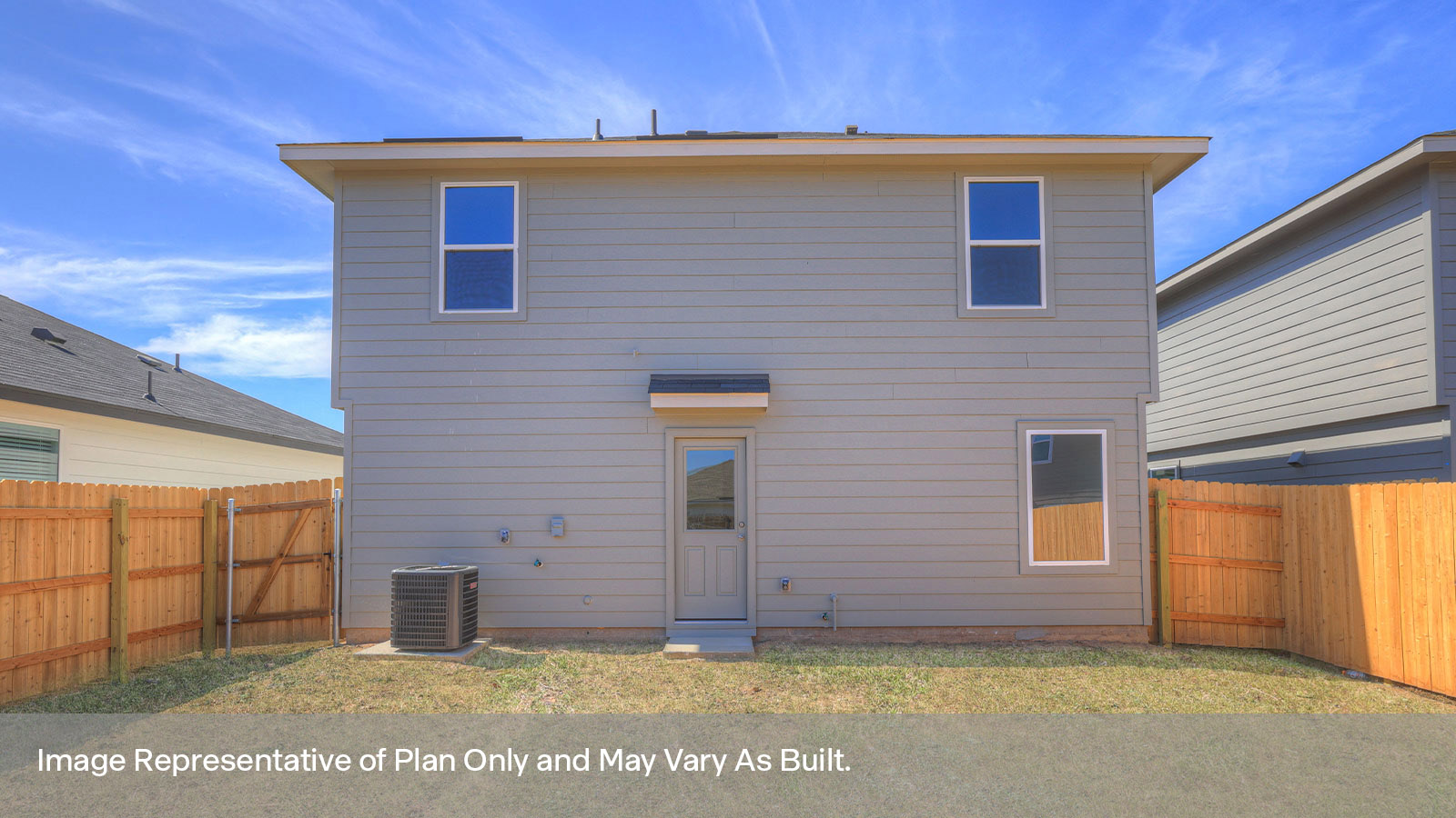 Backyard with sod and privacy fence.