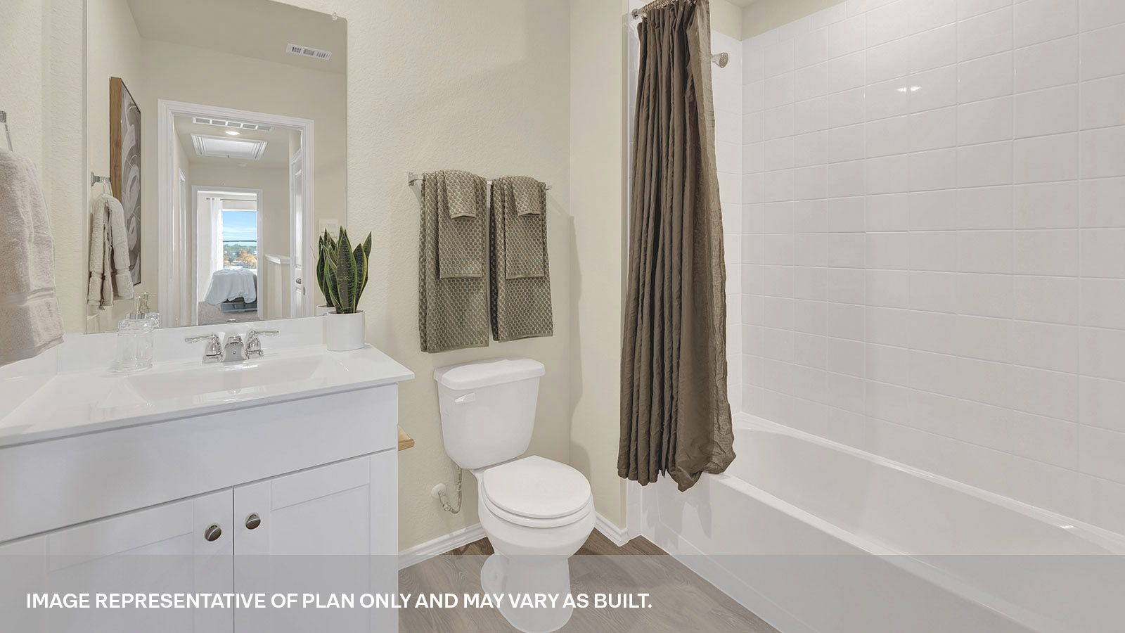 Secondary bathroom with vanity and shower/tub combination.