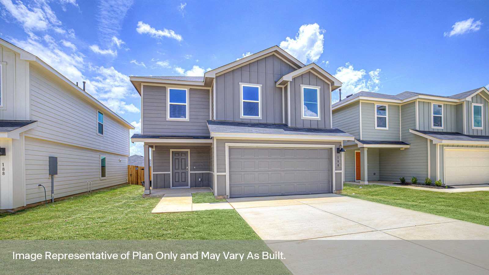 Two-story farmhouse exterior photo with 2 car garage.