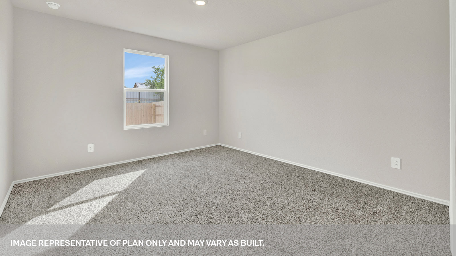 Main bedroom with carpeting and one window.