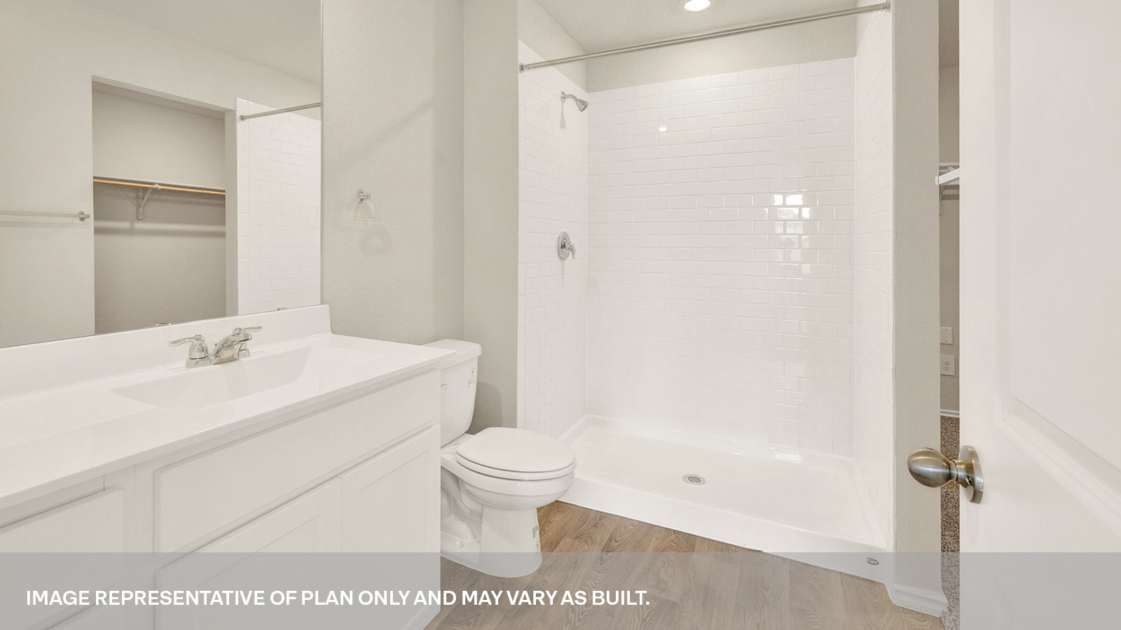 Main bathroom with vanity, toilet, and shower.
