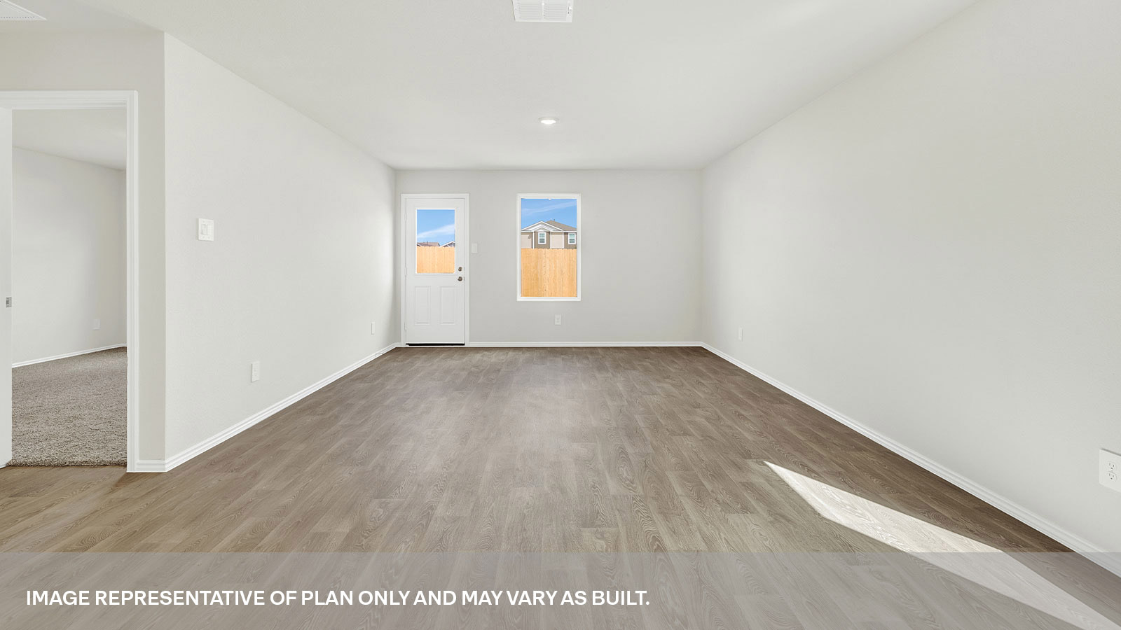 Living room with vinyl flooring, one window, and a half lite exteriror door.