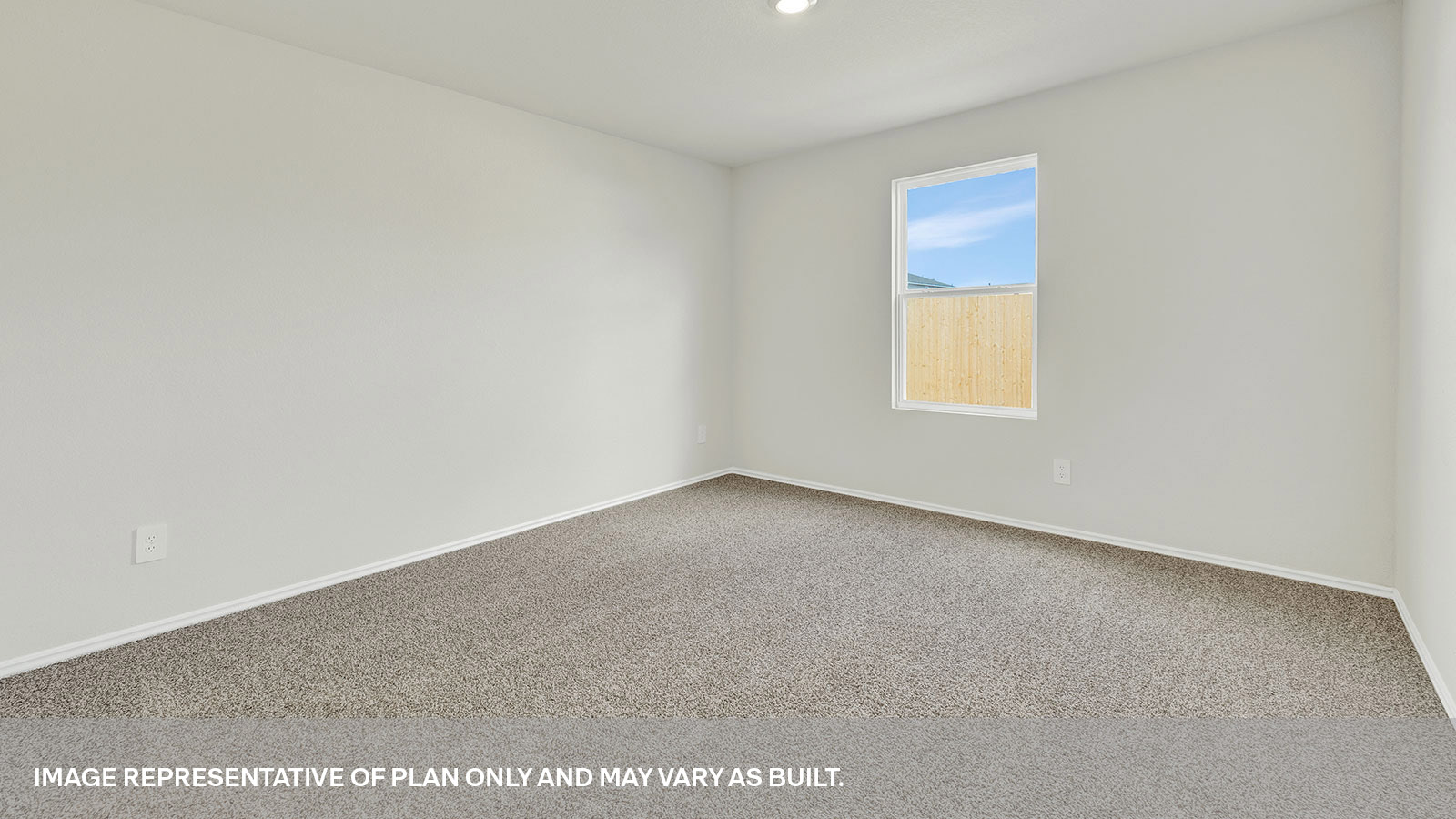 Main bedroom with carpeting and one window.