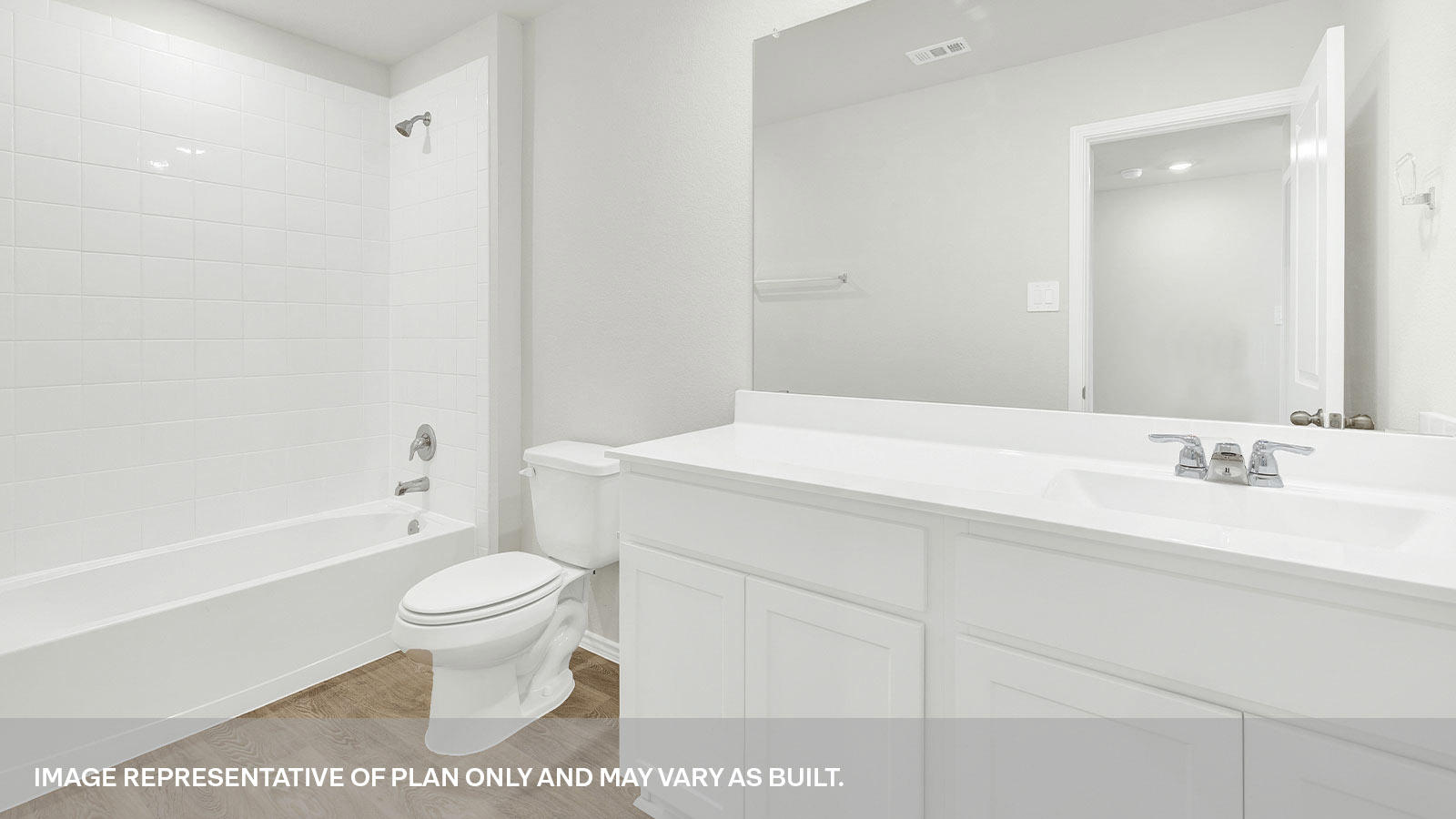 Hall bathroom with vanity, toilet, and shower.