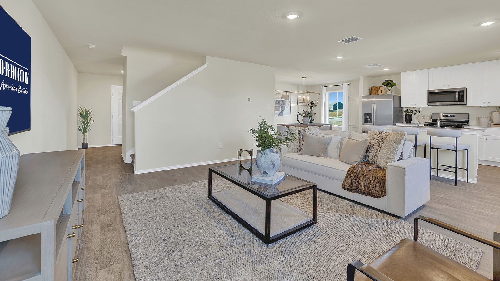 Living room opening to the dining room and kitchen.