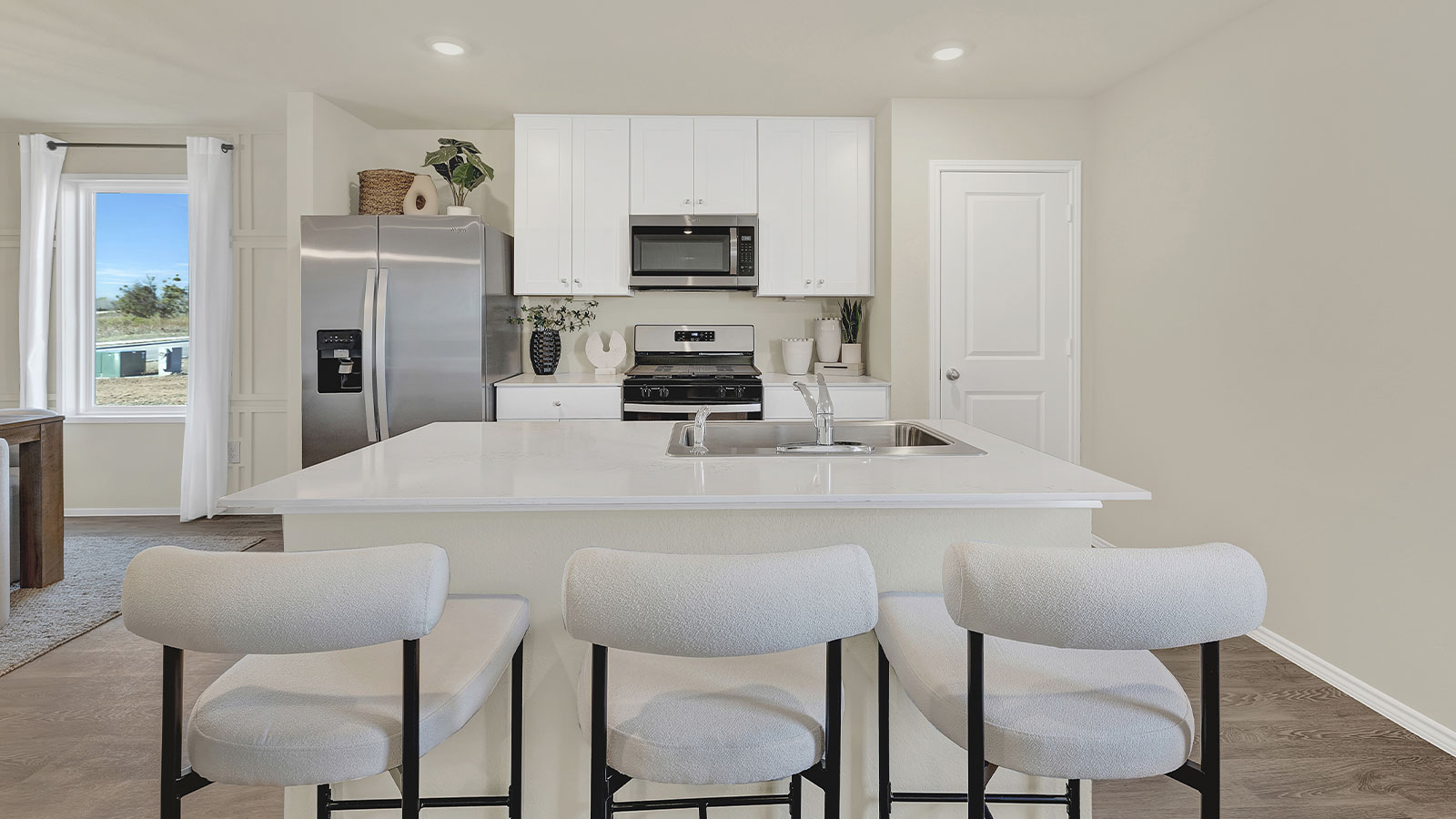 Kitchen with kitchen island and quartz countertops.