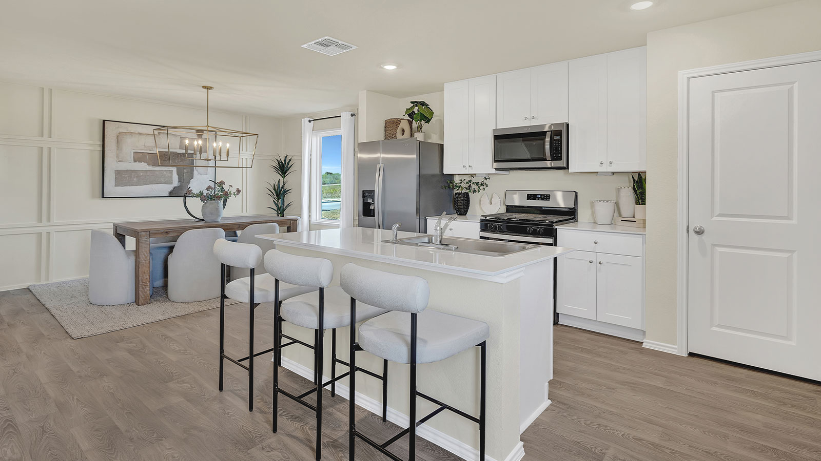 Kitchen with kitchen island opening to the dining room.
