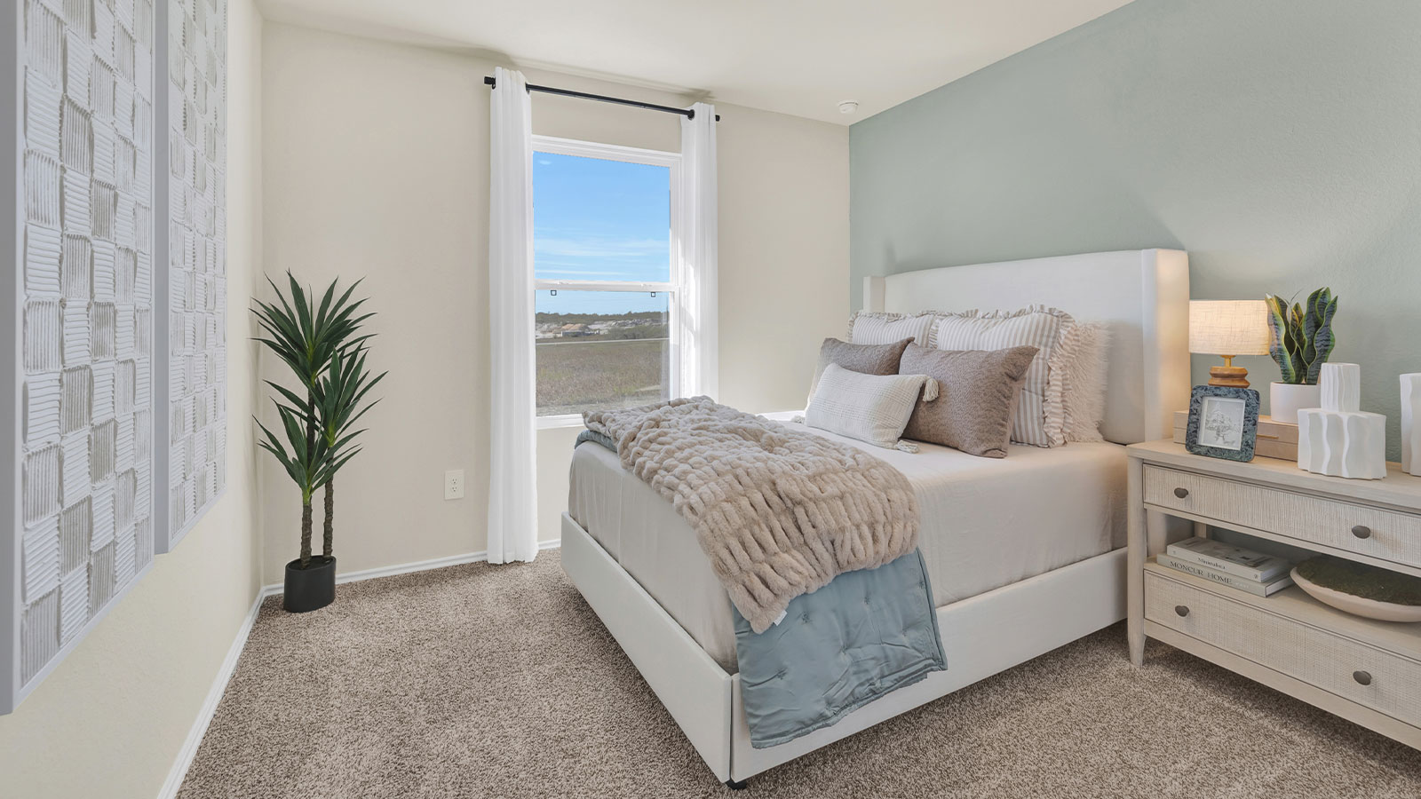 Bedroom with carpeting and one window.