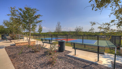 Sunset Oaks Pickeball Court with benches.
