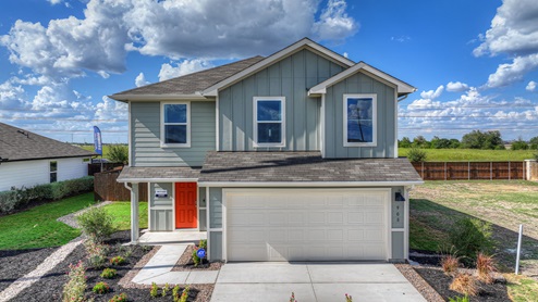 Two-story farmhouse exterior photo with 2 car garage.