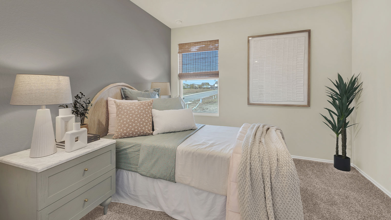 Bedroom with carpeting and one window.