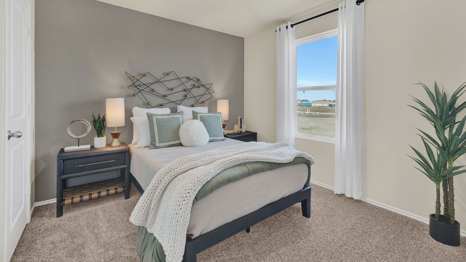 Bedroom with carpeting and one window.