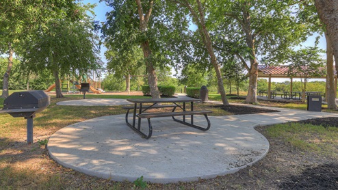 Sunset Oaks picnic tables by walking trail.