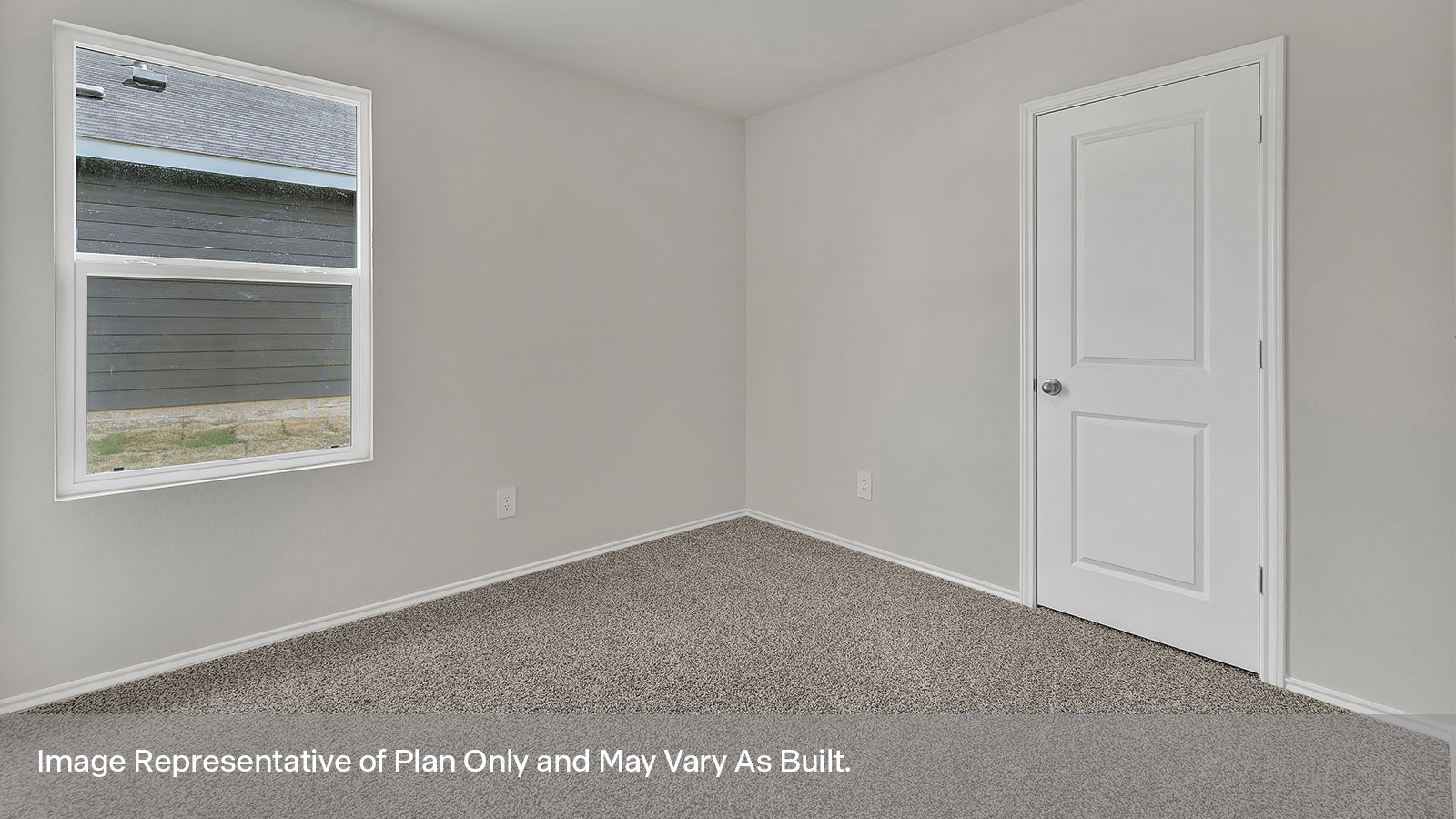 Hall bedroom with carpeting and one window.