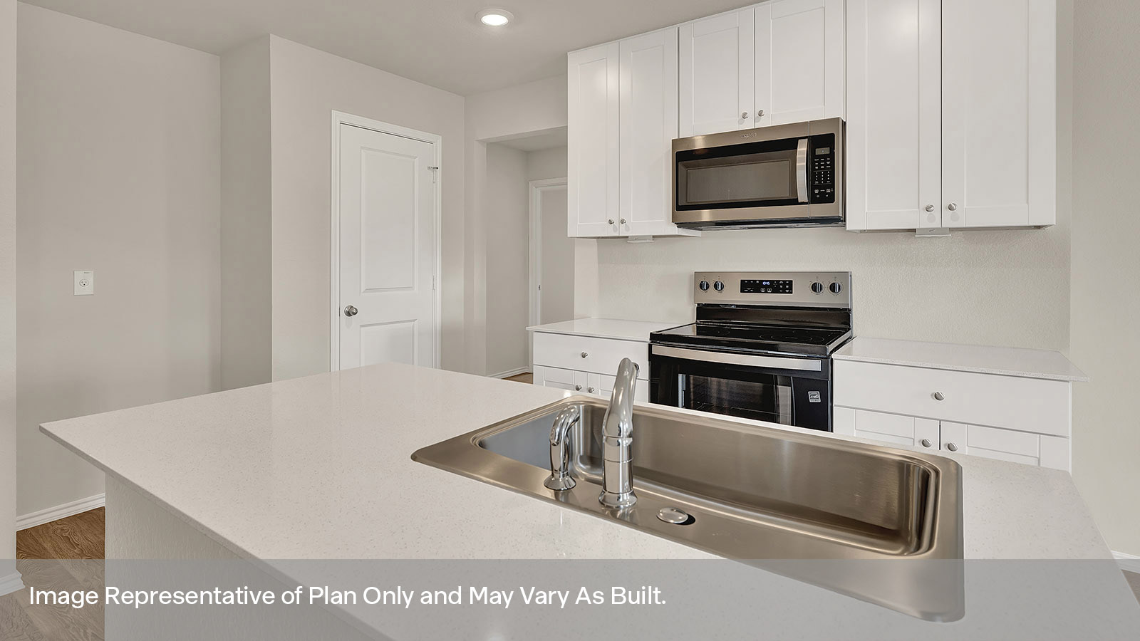 Kitchen with kitchen island and quartz countertops.