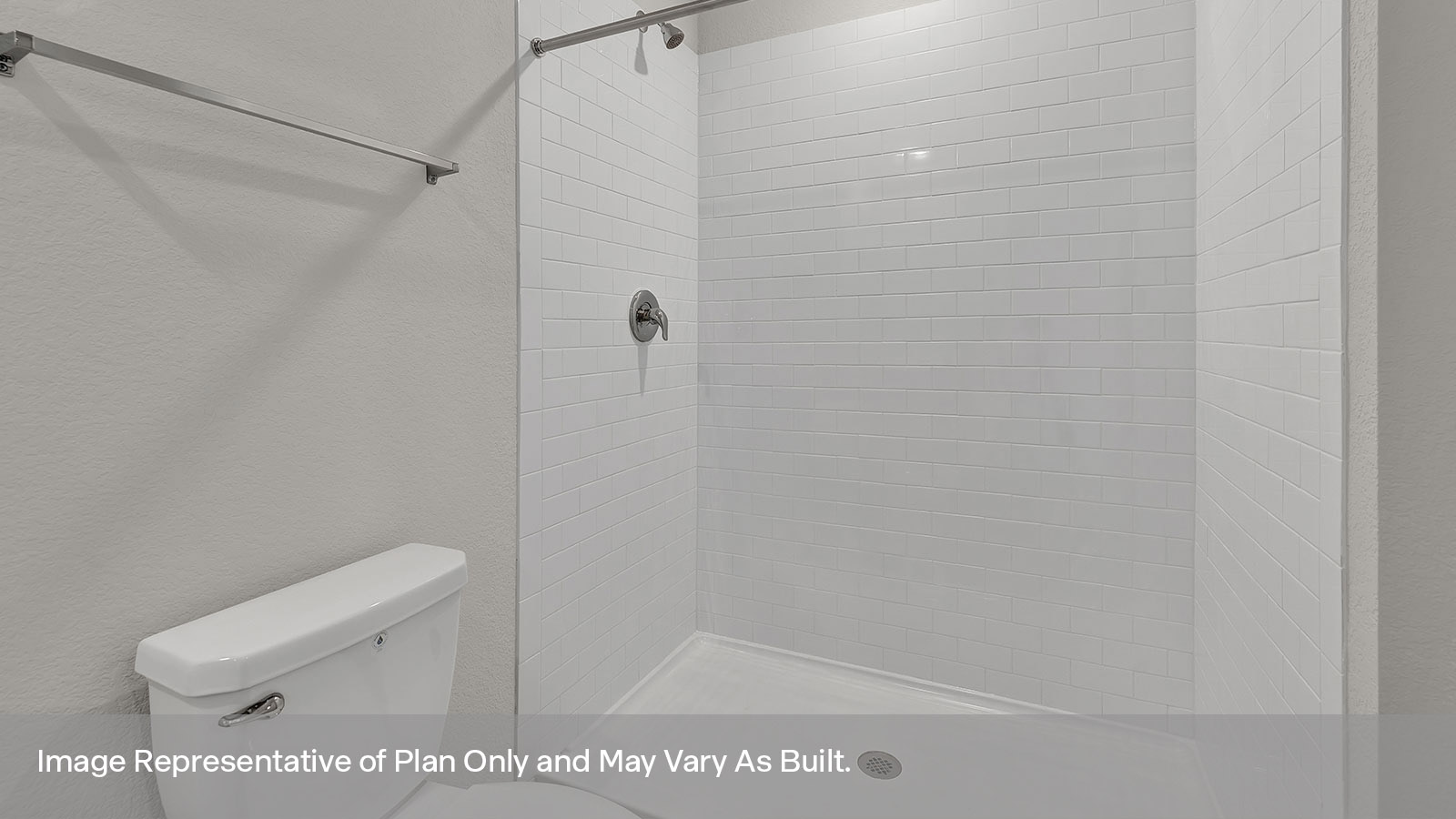 Main bathroom with vanity, toilet, and tiled shower.