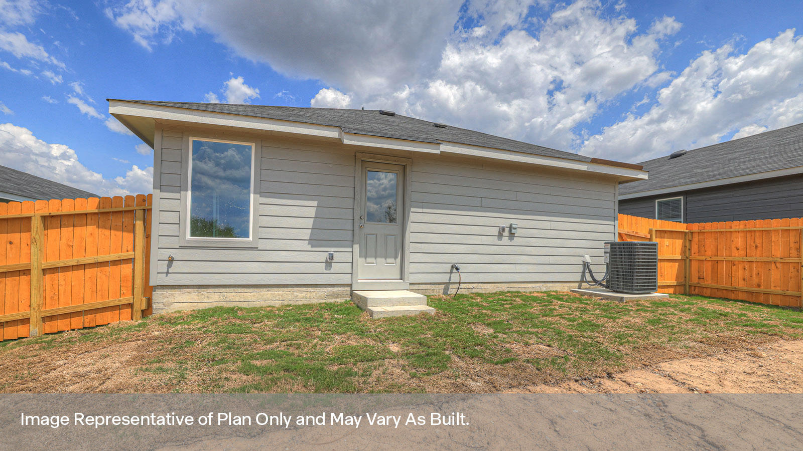 Backyard with sod and privacy fence.