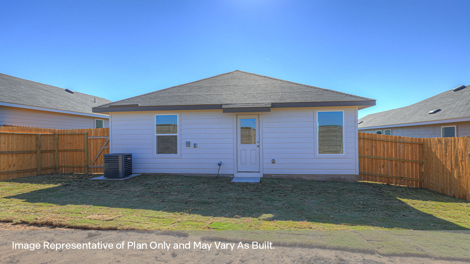 Backyard with sod and privacy fence.