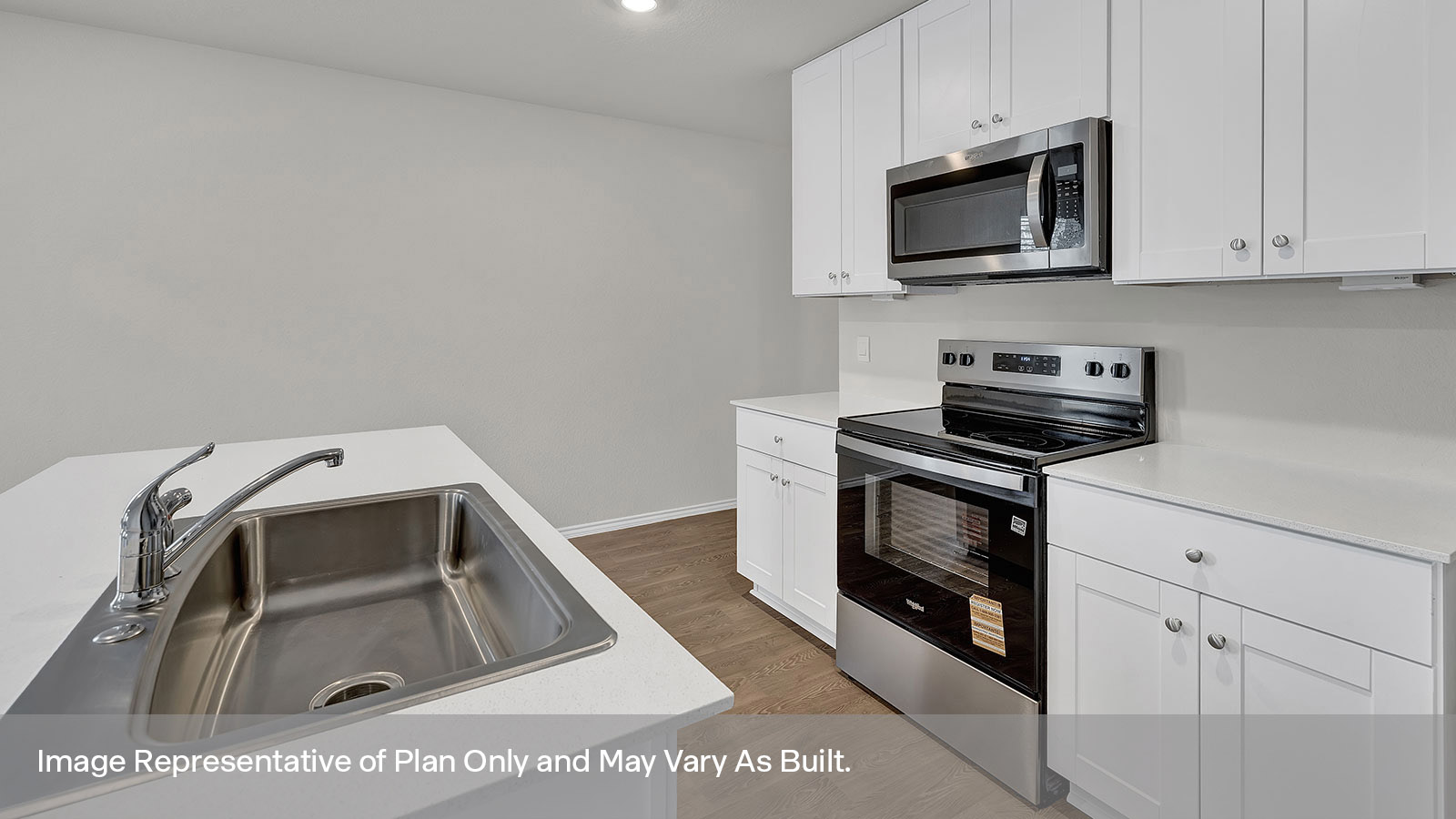 Kitchen with kitchen island and sink.