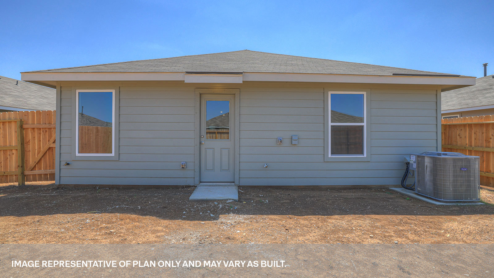 Backyard with sod and privacy fence.