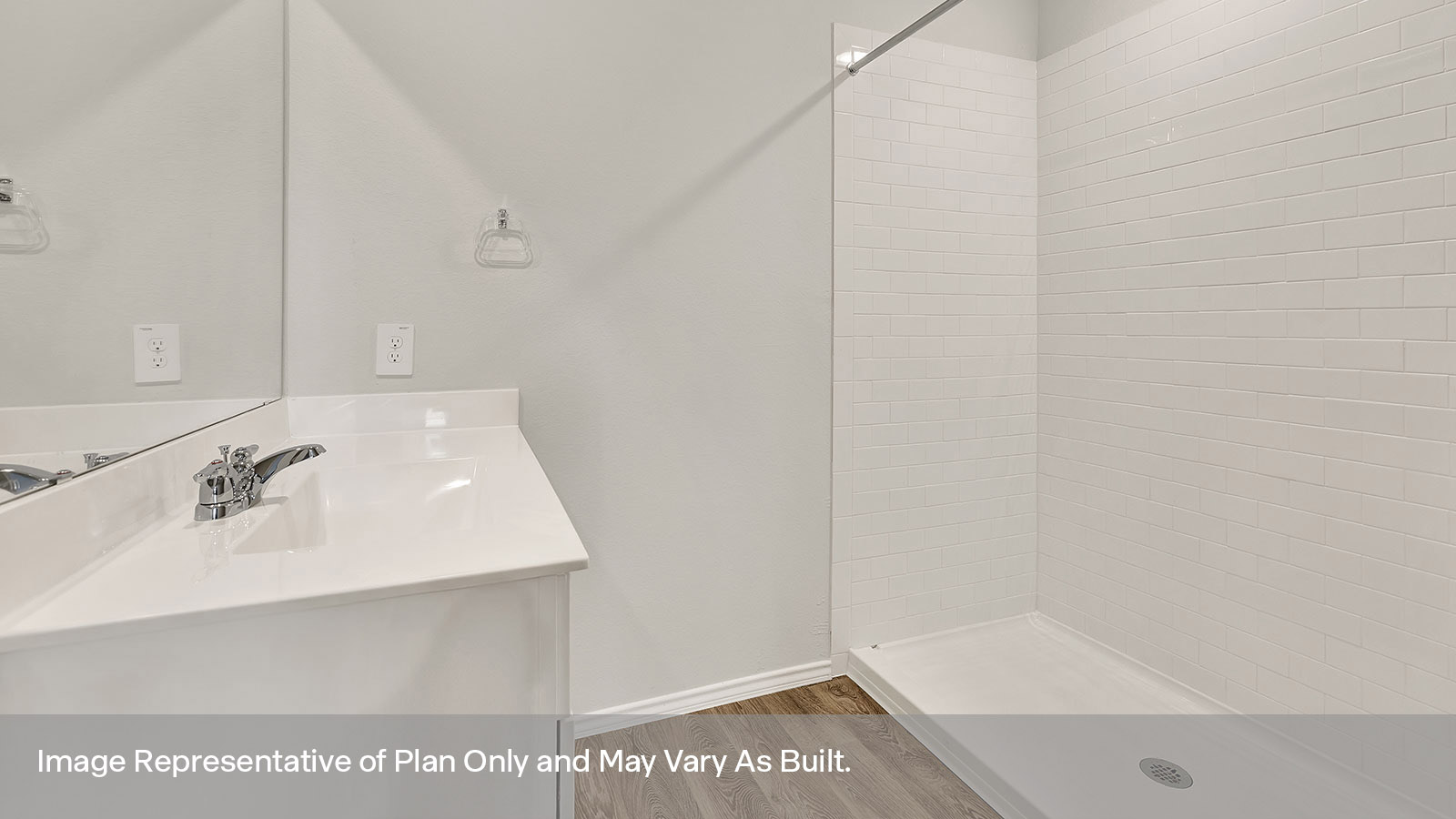 Main bathroom with single sink vanity and tile shower.