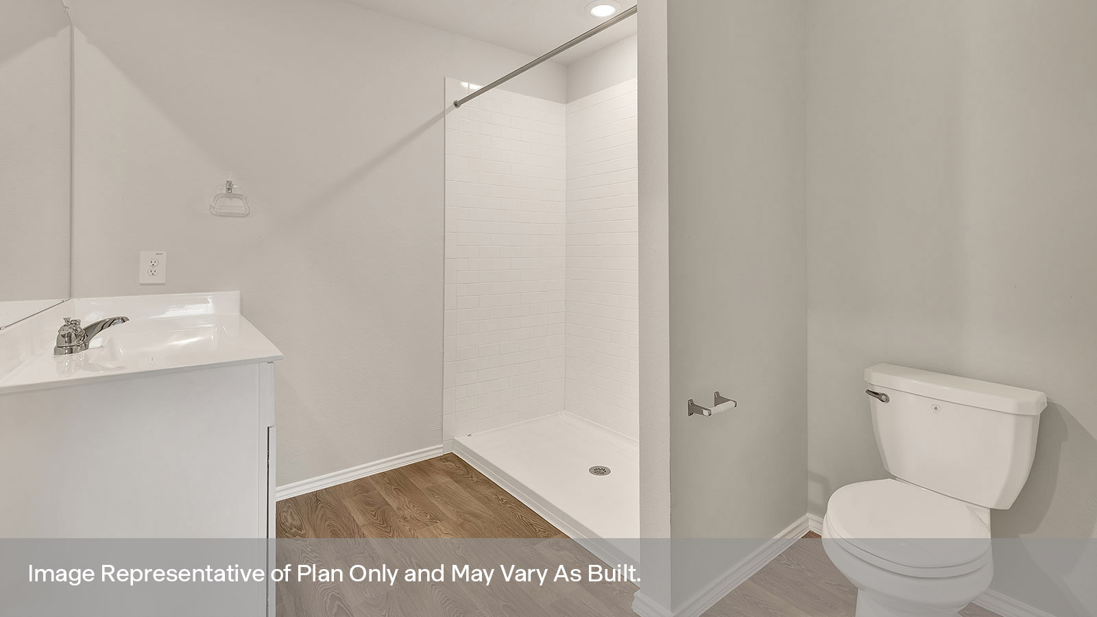 Main bathroom with single sink vanity, toilet, and tile shower.