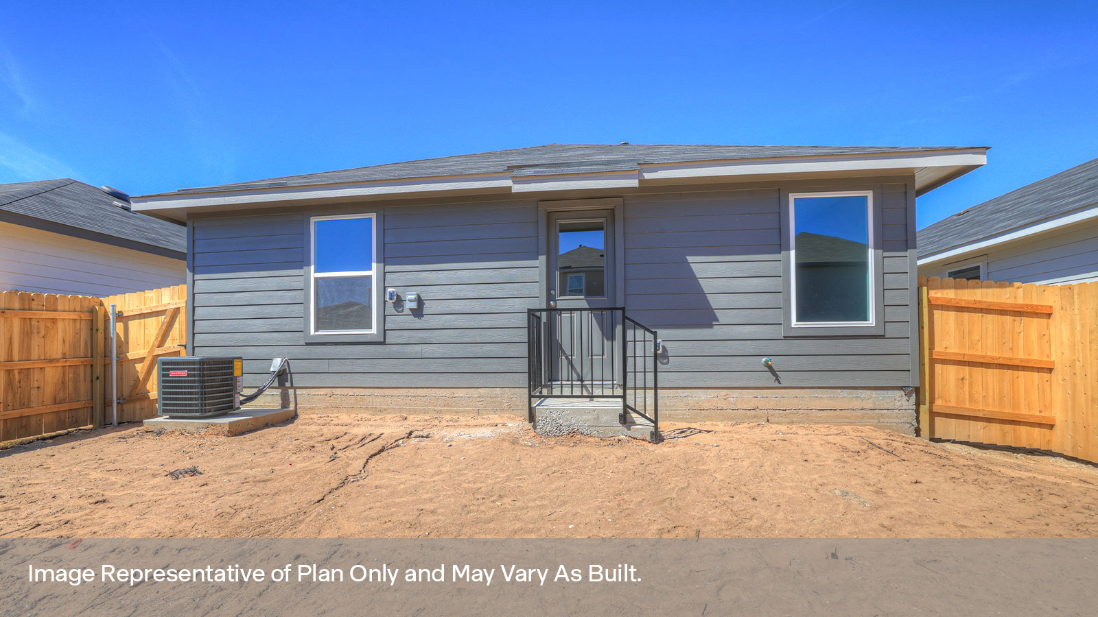 Backyard with sod and privacy fence.