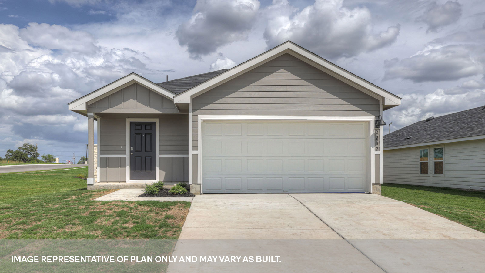Single-story farmhouse with 2 car garage.