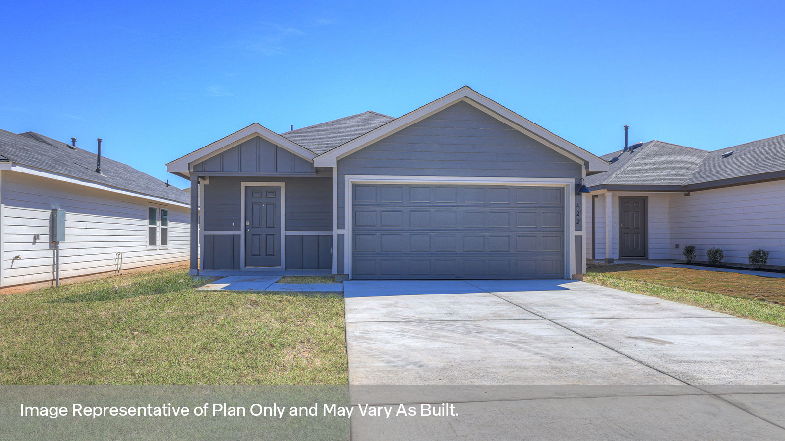 Single-story farmhouse with 2 car garage.