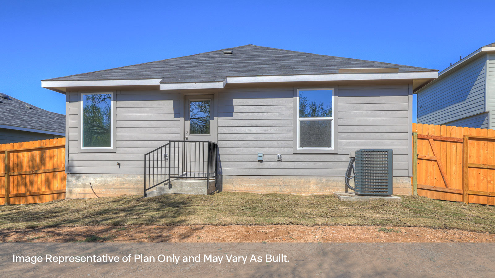 Backyard with sod and privacy fence.