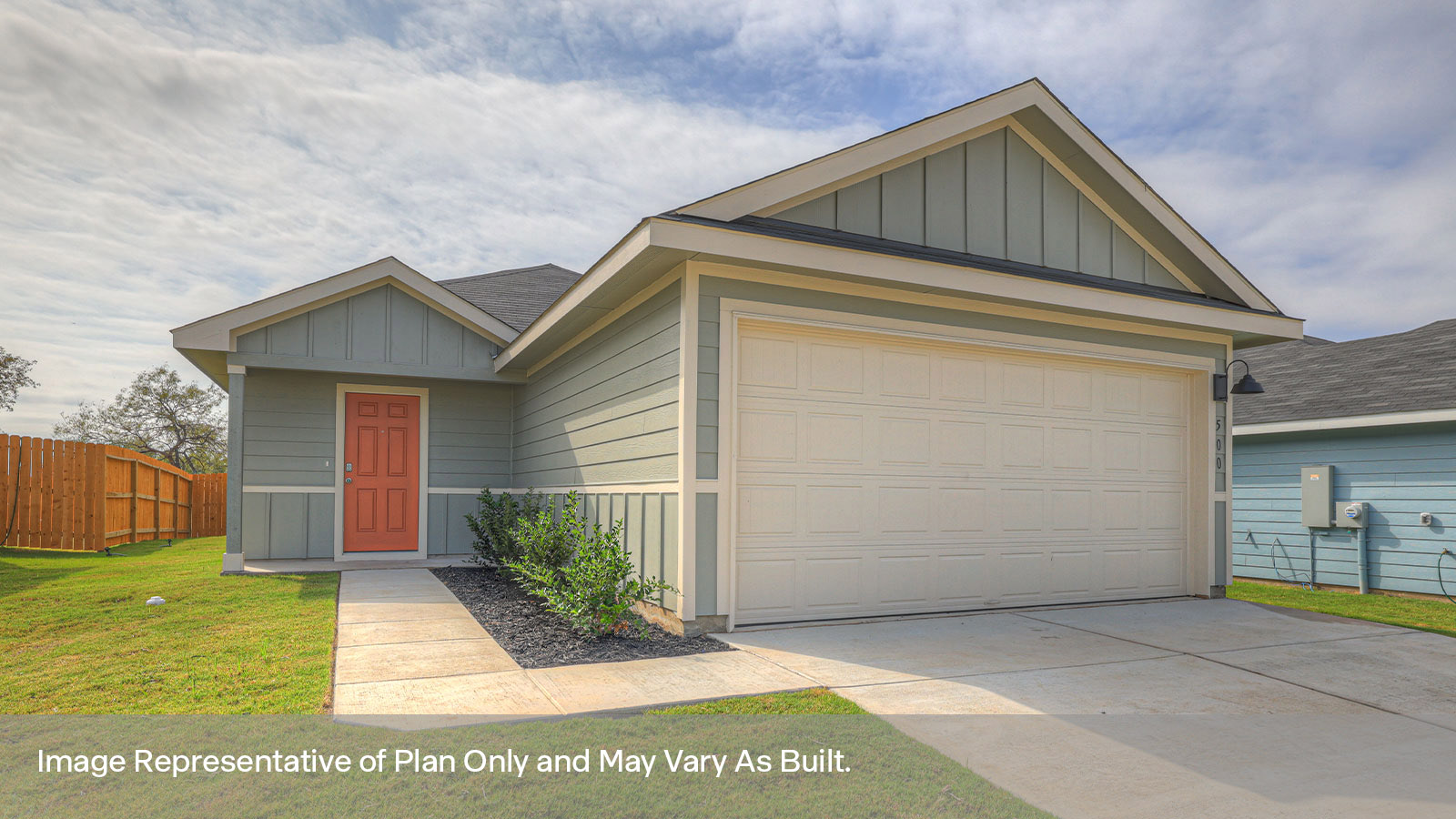 Single-story farmhouse exterior with 2 car garage and two windows.