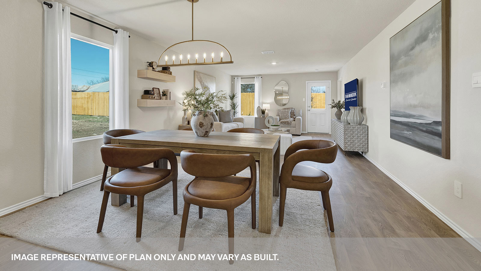 Dining room and living room featuring two windows and a door to the back yard